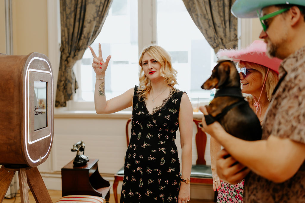 Our vintage selfie mirror in action. 2 people pose while I count them down ready for their photo